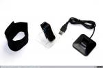 1777 - Clip de actividad Fitbit Ultra en la pinza para cinturón junto a la muñequera de sueño y base USB y radio (1), 2009
